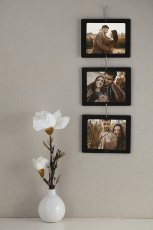 שרשרת של 3 תמונות עץ בסלון